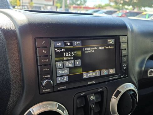 Used 2014 Jeep Wrangler Unlimited Sahara w/ Dual Top Group AWD/4WD image 16