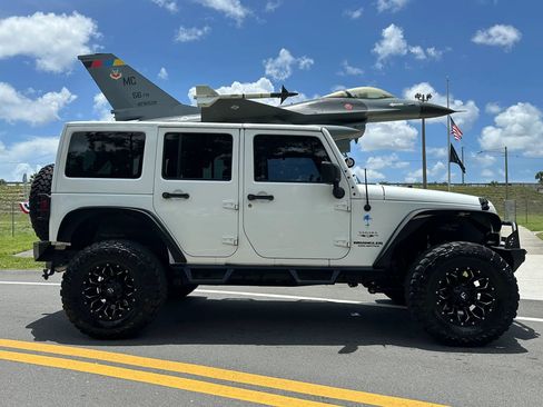 Used 2016 Jeep Wrangler Unlimited Sahara AWD/4WD image 1