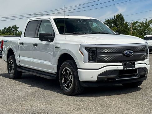 Used 2023 Ford F150 Lightning XLT AWD/4WD image 1