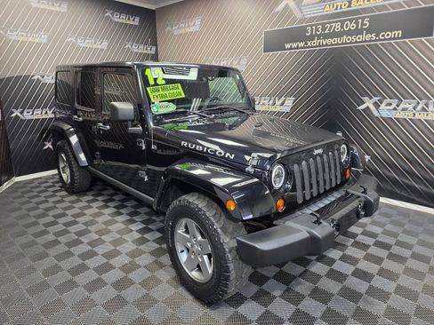 Used 2012 Jeep Wrangler Unlimited Rubicon w/ Dual Top Group AWD/4WD image 7