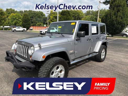 Used 2013 Jeep Wrangler Unlimited Sahara w/ Dual Top Group AWD/4WD image 1