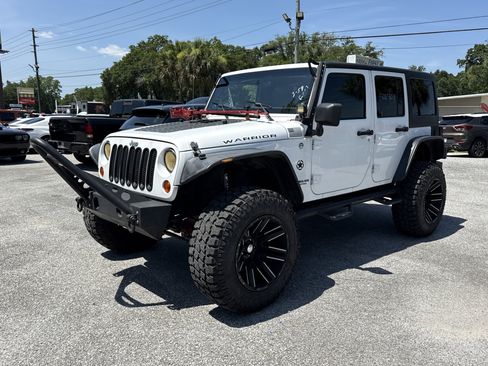 Used 2012 Jeep Wrangler Unlimited Sport AWD/4WD image 1