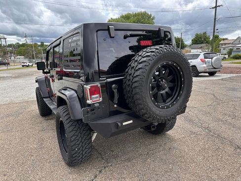 Used 2013 Jeep Wrangler Unlimited Sahara w/ Dual Top Group AWD/4WD image 12