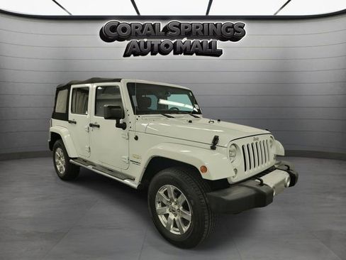 Used 2014 Jeep Wrangler Unlimited Sahara w/ Dual Top Group AWD/4WD image 1