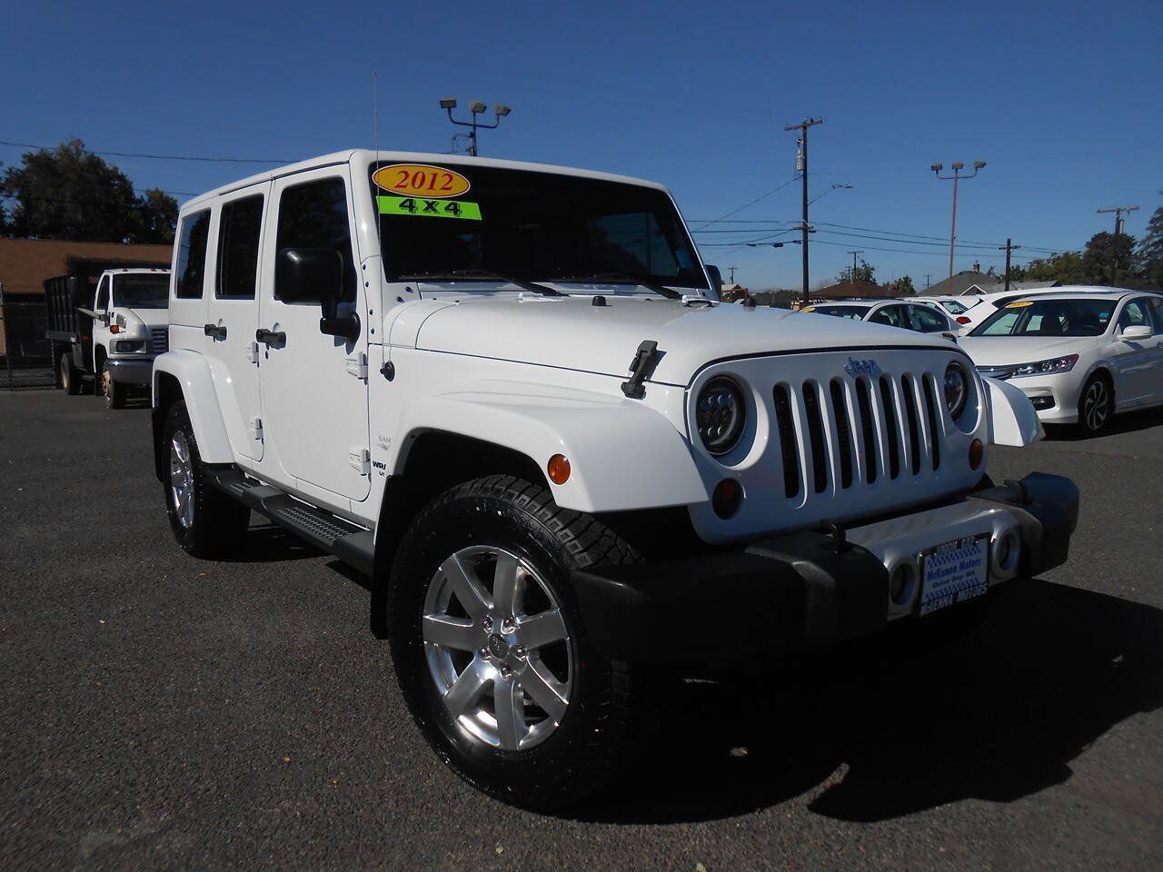 Used 2012 Jeep Wrangler Unlimited Sahara w/ Dual Top Group AWD/4WD image 1