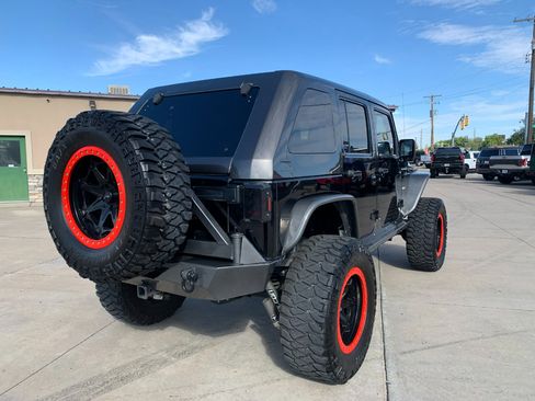 Used 2010 Jeep Wrangler Unlimited Rubicon w/ Dual Top Group image 8