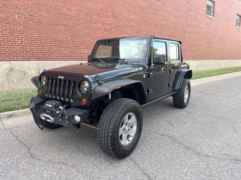 Used 2012 Jeep Wrangler Unlimited Rubicon w/ Dual Top Group AWD/4WD image 1