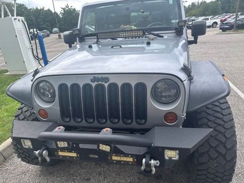 Used 2013 Jeep Wrangler Unlimited Sport w/ Mopar Black Appearance Group AWD/4WD image 2
