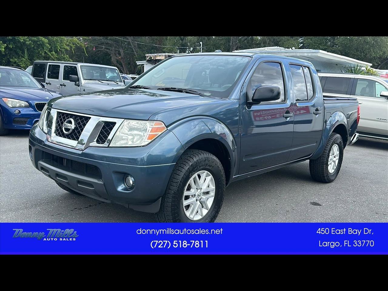 Used 2014 Nissan Frontier SV w/ SV Value Truck Package AWD/4WD image 1
