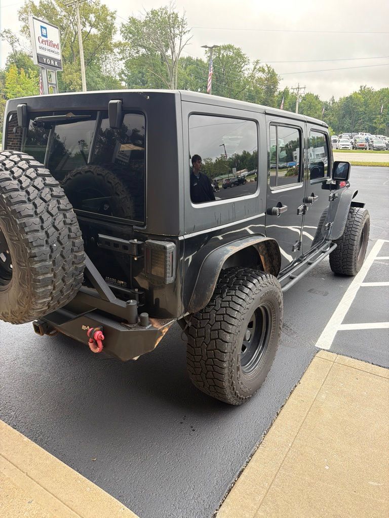 Used 2011 Jeep Wrangler Unlimited Rubicon w/ Dual Top Group AWD/4WD image 4
