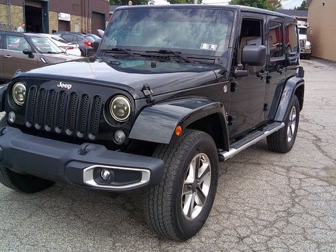 Used 2014 Jeep Wrangler Unlimited Sahara w/ Dual Top Group AWD/4WD image 1