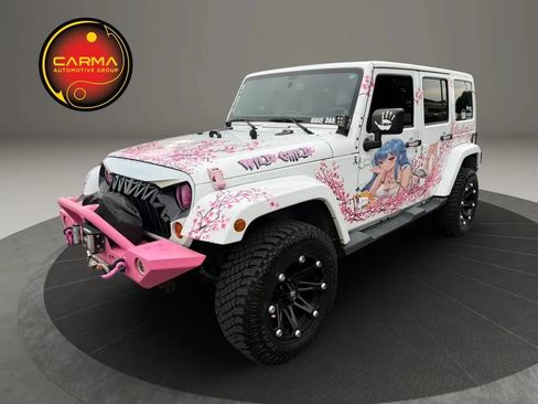 Used 2013 Jeep Wrangler Unlimited Sahara w/ Connectivity Group AWD/4WD image 1