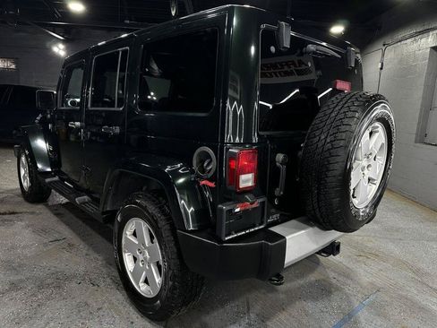 Used 2012 Jeep Wrangler Unlimited Sahara w/ Dual Top Group AWD/4WD image 4