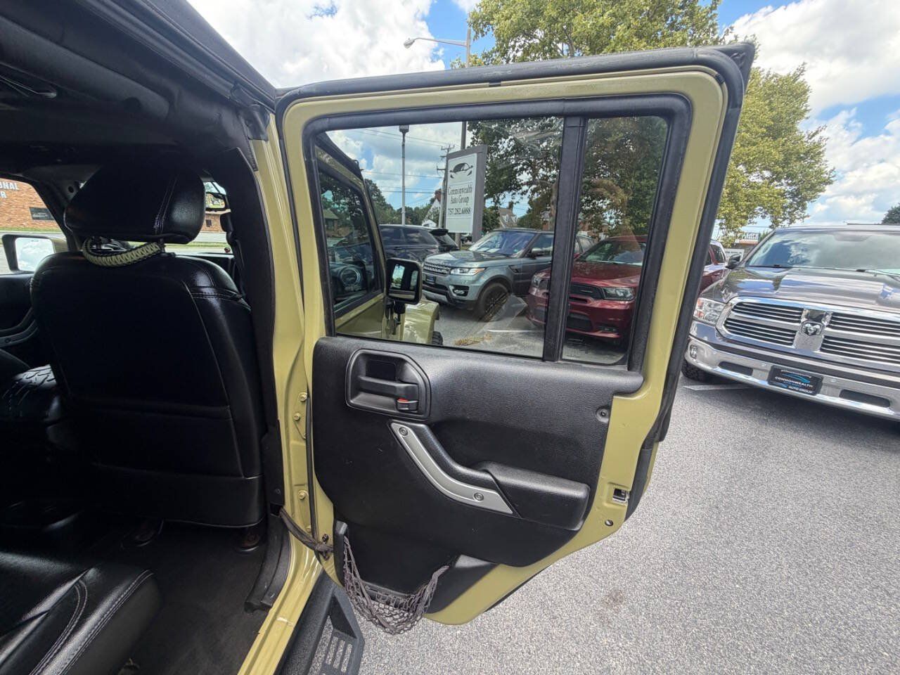 Used 2013 Jeep Wrangler Unlimited Sahara w/ Dual Top Group AWD/4WD image 16