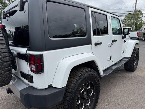Used 2014 Jeep Wrangler Unlimited Sahara w/ Dual Top Group AWD/4WD image 11