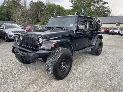 Used 2011 Jeep Wrangler Unlimited Sahara w/ Dual Top Group AWD/4WD image 1