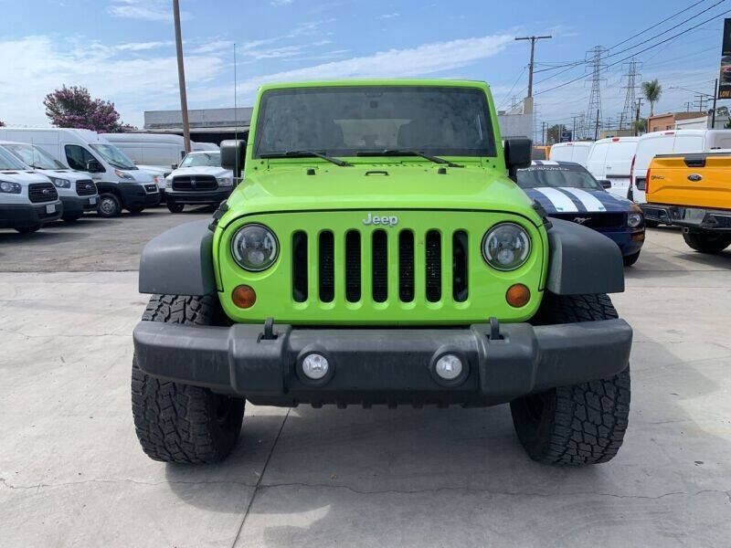 Used 2013 Jeep Wrangler Unlimited Sport w/ Mopar Black Appearance Group AWD/4WD image 2