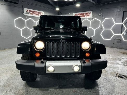 Used 2012 Jeep Wrangler Unlimited Sahara w/ Dual Top Group AWD/4WD image 9