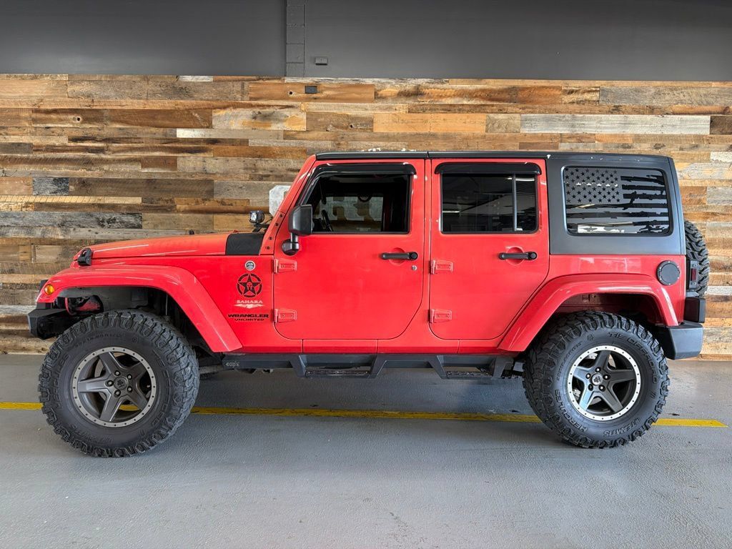 Used 2013 Jeep Wrangler Unlimited Sahara w/ Dual Top Group AWD/4WD image 10