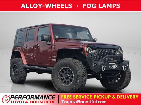 Used 2010 Jeep Wrangler Unlimited Sahara w/ Dual Top Group AWD/4WD image 1