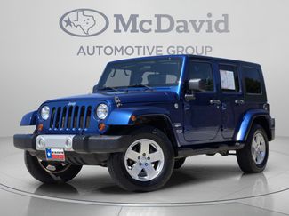 Used 2010 Jeep Wrangler Unlimited Sahara w/ Dual Top Group AWD/4WD video 1