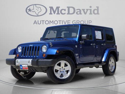 Used 2010 Jeep Wrangler Unlimited Sahara w/ Dual Top Group AWD/4WD image 1