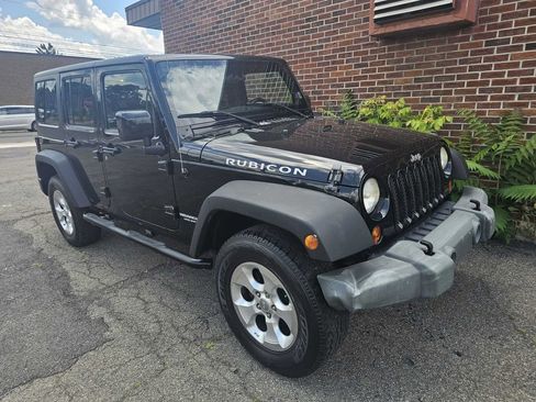 Used 2012 Jeep Wrangler Unlimited Rubicon w/ Dual Top Group image 9