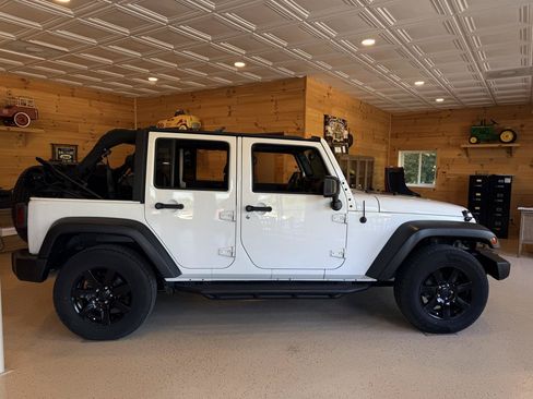 Used 2014 Jeep Wrangler Unlimited Sahara AWD/4WD image 1