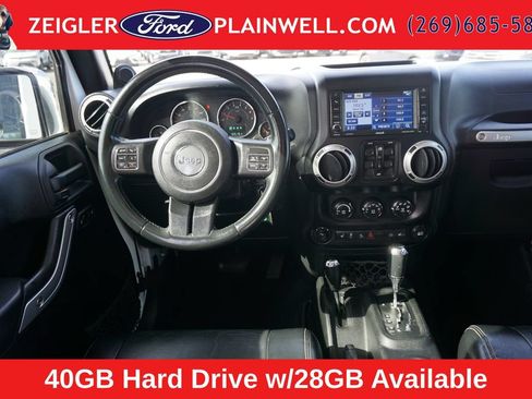 Used 2012 Jeep Wrangler Unlimited Sahara w/ Dual Top Group AWD/4WD image 12