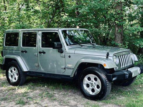 Used 2014 Jeep Wrangler Unlimited Sahara w/ Dual Top Group AWD/4WD image 1