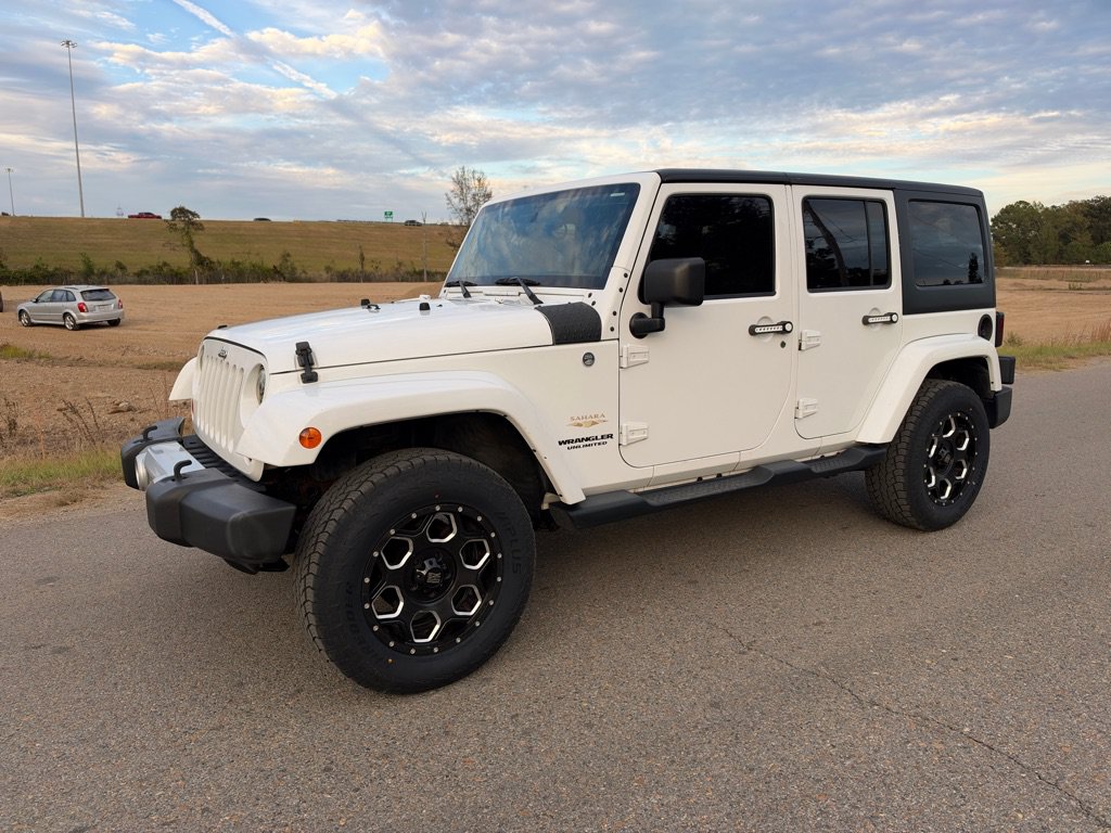 Used 2013 Jeep Wrangler Unlimited Sahara w/ Dual Top Group AWD/4WD image 1