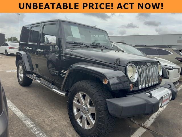 Used 2012 Jeep Wrangler Unlimited Sahara w/ Dual Top Group AWD/4WD image 1