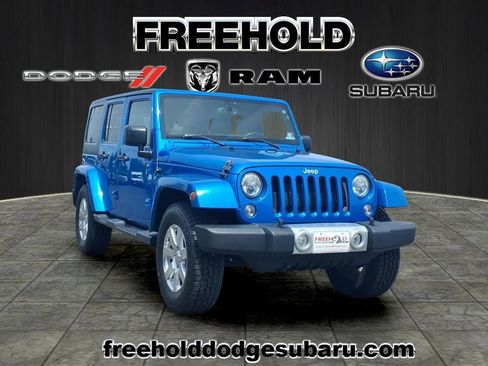 Used 2015 Jeep Wrangler Unlimited Sahara w/ Dual Top Group AWD/4WD image 1