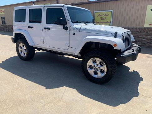 Used 2015 Jeep Wrangler Unlimited Sahara AWD/4WD image 1