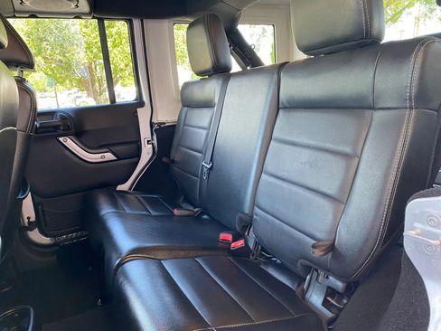 Used 2012 Jeep Wrangler Unlimited Sahara w/ Dual Top Group AWD/4WD image 16