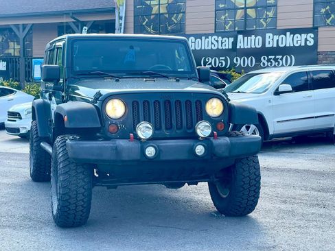 Used 2010 Jeep Wrangler Unlimited Sport w/ Dual Top Group AWD/4WD image 1