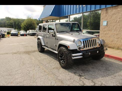 Used 2016 Jeep Wrangler Unlimited Sahara w/ Max Tow Package AWD/4WD image 1