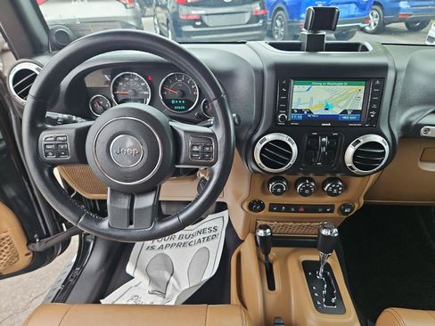 Used 2012 Jeep Wrangler Unlimited Sahara w/ Dual Top Group AWD/4WD image 23