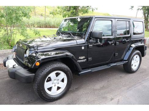 Used 2012 Jeep Wrangler Unlimited Sahara w/ Dual Top Group AWD/4WD image 1