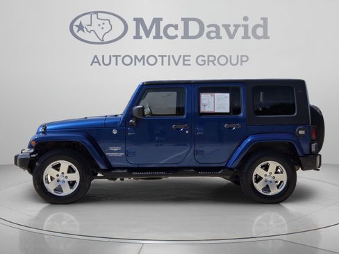 Used 2010 Jeep Wrangler Unlimited Sahara w/ Dual Top Group AWD/4WD image 2