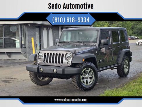 Used 2016 Jeep Wrangler Unlimited Rubicon w/ Dual Top Group AWD/4WD image 1