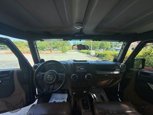 Used 2012 Jeep Wrangler Unlimited Sahara w/ Dual Top Group AWD/4WD image 9
