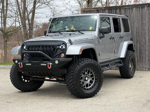 Used 2014 Jeep Wrangler Unlimited Rubicon w/ Dual Top Group AWD/4WD image 1