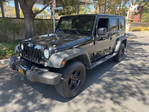 Used 2015 Jeep Wrangler Unlimited Sport w/ Dual Top Group AWD/4WD image 1