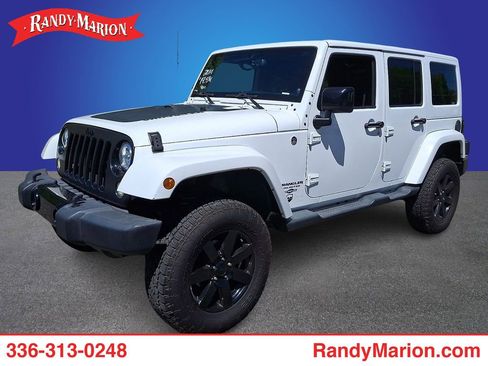 Used 2014 Jeep Wrangler Unlimited Sahara AWD/4WD image 1