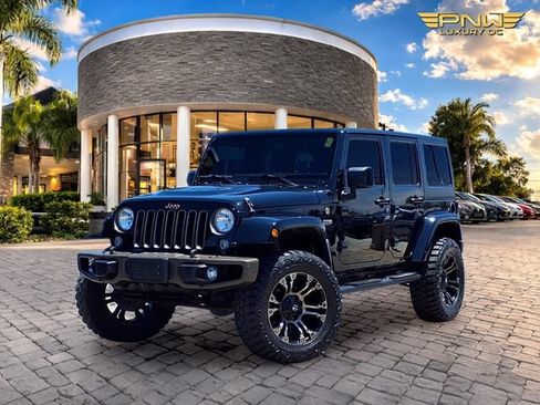 Used 2016 Jeep Wrangler Unlimited Sahara AWD/4WD image 1