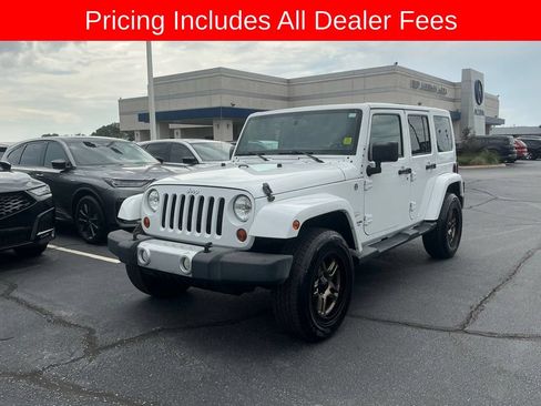 Used 2013 Jeep Wrangler Unlimited Sahara w/ Dual Top Group AWD/4WD image 1