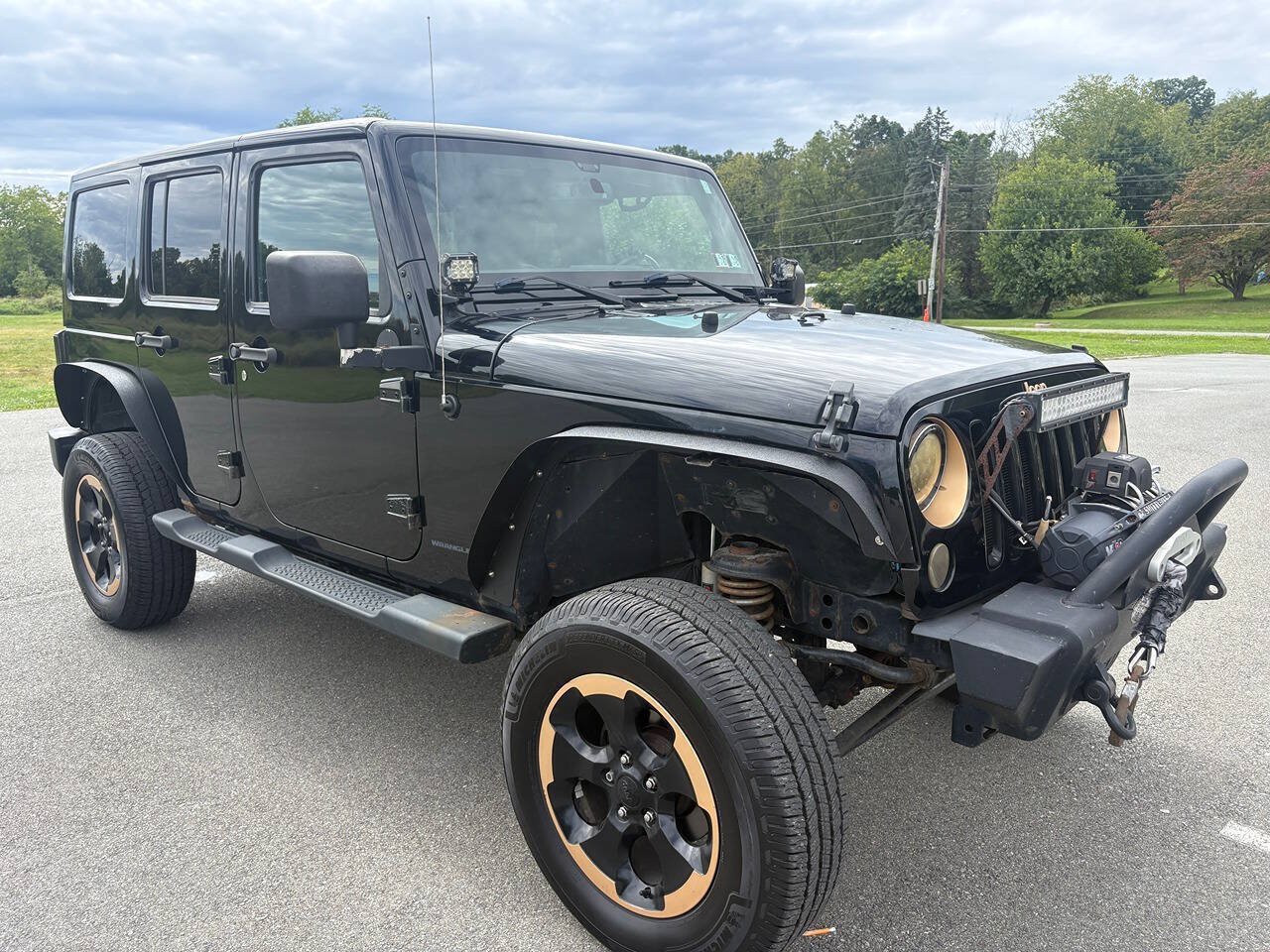 Used 2014 Jeep Wrangler Unlimited Sahara AWD/4WD image 1
