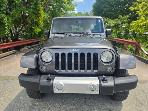 Used 2014 Jeep Wrangler Unlimited Sahara w/ Dual Top Group AWD/4WD image 1