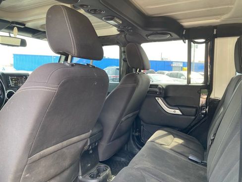 Used 2013 Jeep Wrangler Unlimited Sahara w/ Dual Top Group AWD/4WD image 13